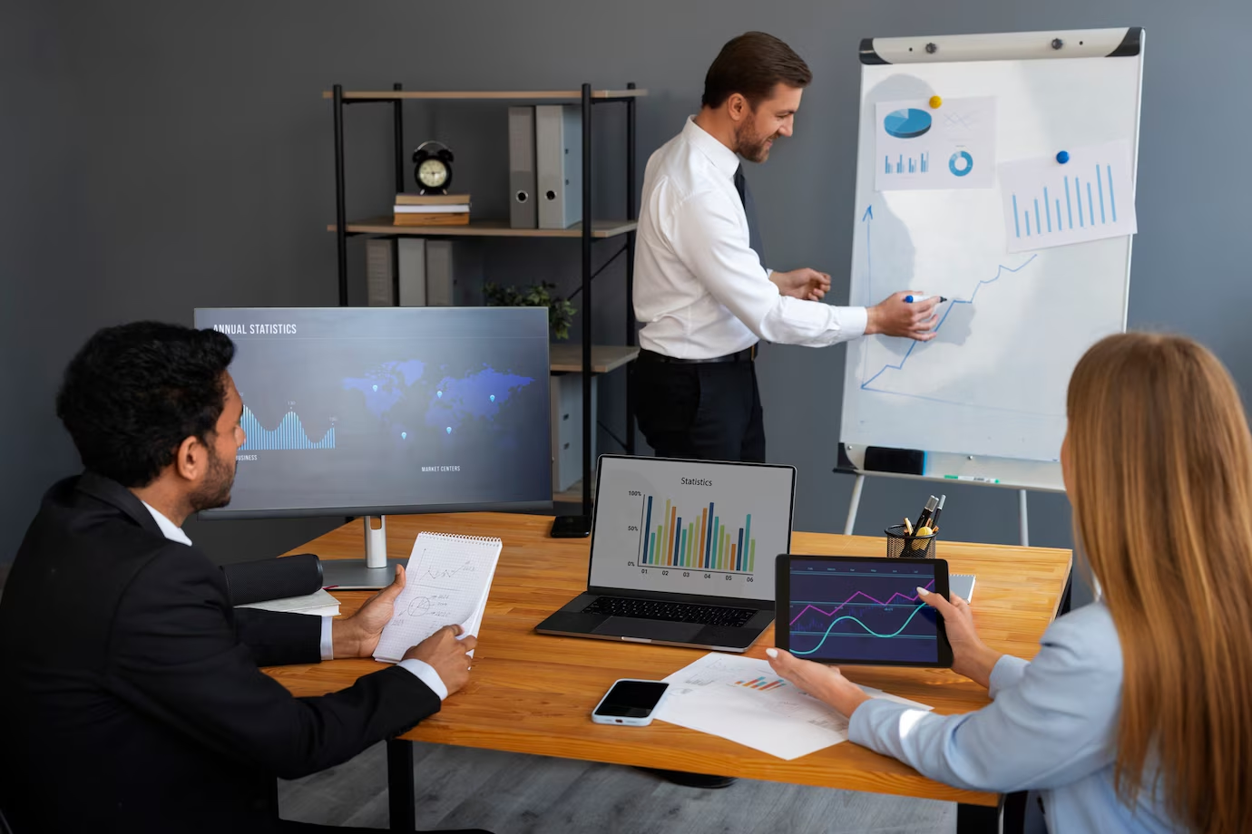 Professional team discussing IT consulting services in Malaysia office setting