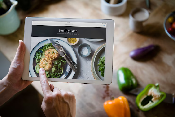 Website design displayed on laptop with famous Netherlands landmarks in background