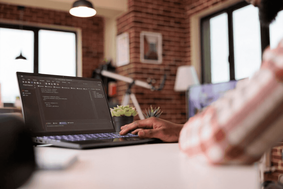 Coding dynamic website features on laptop for Netherlands clients